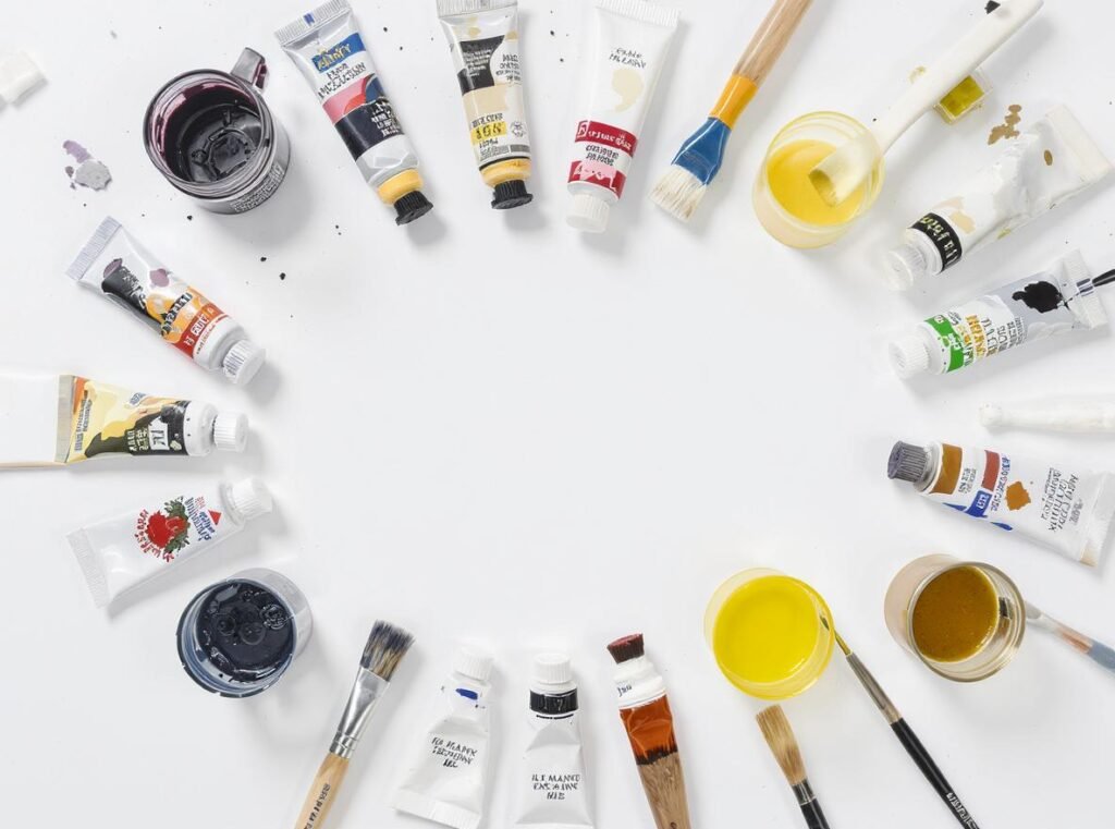 Different paint types including acrylics, watercolors, and oil paints showing compatibility with hair dryer drying