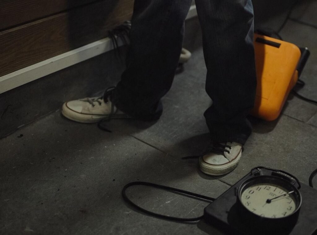 Emergency hair dryer use on shoes showing proper distance and safety precautions