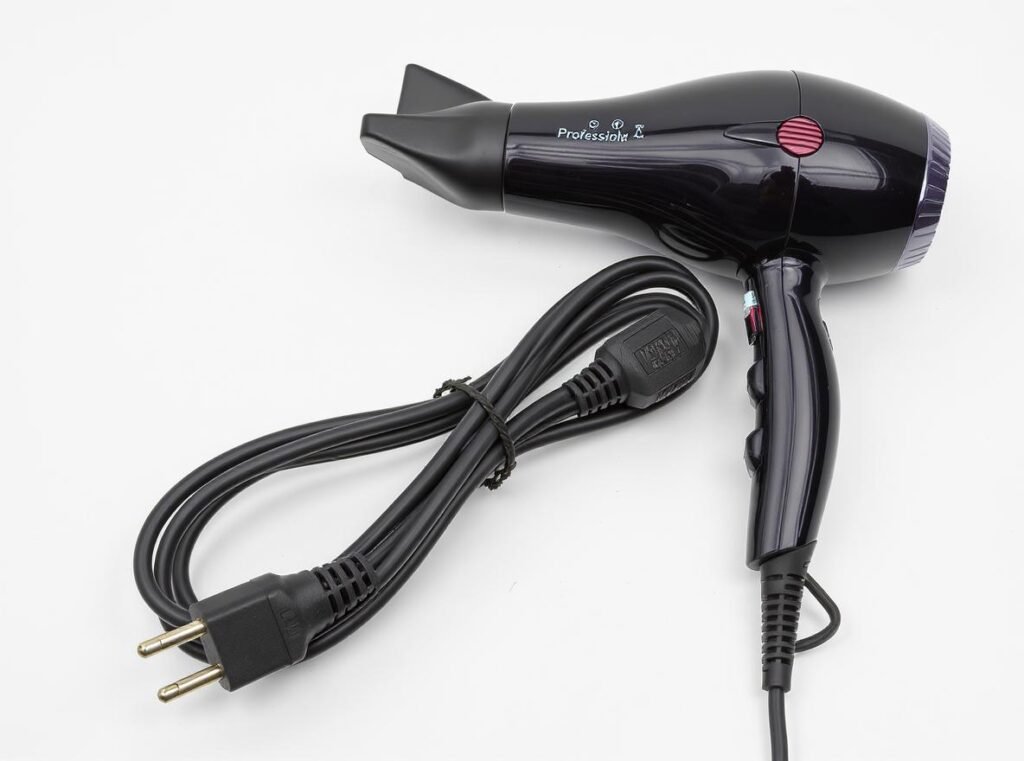 Professional hair dryer electrical cord showing proper gauge and polarized plug design