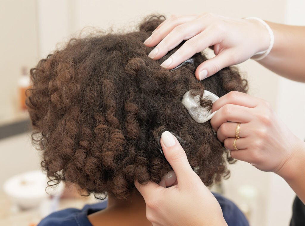 Strategic product layering for optimal diffusing results on curly hair
